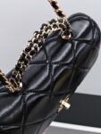 CHANEL Black quilted leather handbag with chain strap