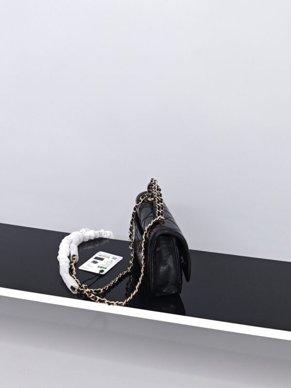 CHANEL Black quilted leather handbag with chain strap